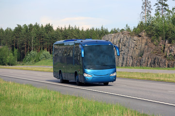 Blue Coach Bus on Summer Freeway