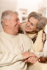 elderly couple with cup of tea