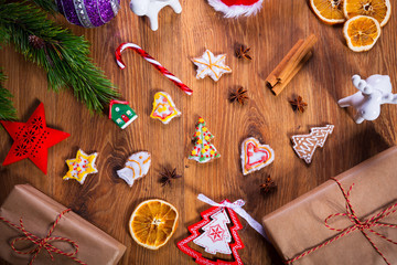 Top view of Christmas spices and decorations on wooden table