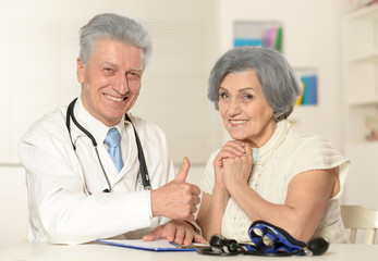 Senior doctor with elderly patient