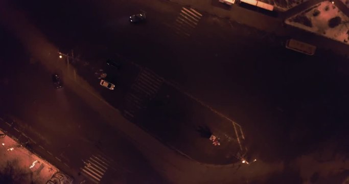 Night drift car nissan in the traffic circular motion city. Aerial turns top view
