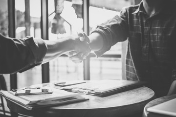 businessman handshaking process after successful deal of business meeting,Close up image handshake of business partnership.