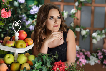 Girl in black dress in the garden