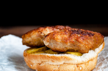 open sandwich with meat cutlets and pickled cucumbers