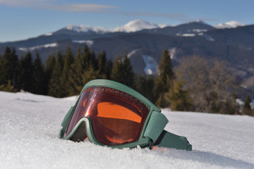 Ski mask in front of beautiful mountains. Mountains are callnig