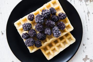 Delicious and beautiful Belgian waffles with blackberries.