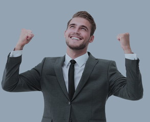Portrait of successful business man winner celebrating