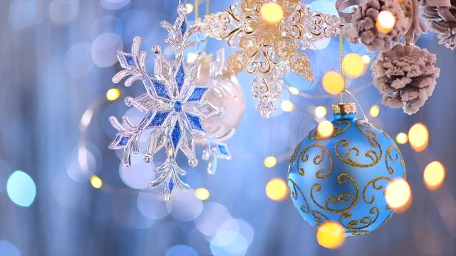 Christmas and New Year blue decoration. Abstract blinking holiday background. Slow motion 4K UHD video footage. 3840X2160