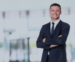 Fototapeta premium Handsome smiling confident businessman portrait