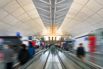 HONG KONG - November 12, 2017: Business passenger and traveler walk in the main terminal for boarding time in Hong Kong International Airport for travel.