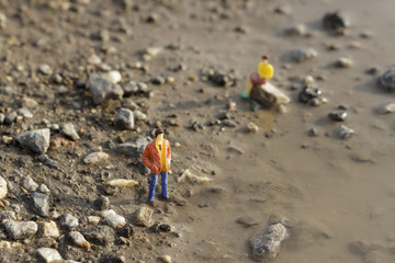 Fototapeta na wymiar Miniature figures on the ground