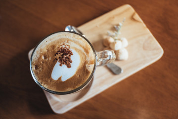 Hot cappuccino coffee on the table 