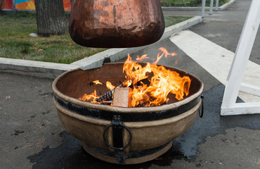 Bowler on an open fire
