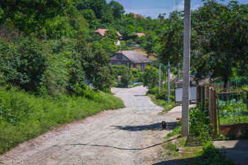 Dust road in small village Yagelnitsa in Ukraine