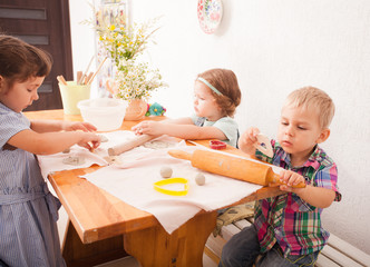 Obraz na płótnie Canvas Happy children are engaged with modeling clay