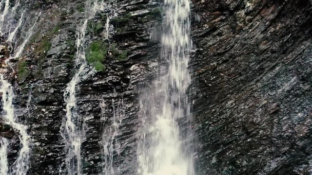 Beautiful autumn waterfall Zhenetskyi Huk in carpathian mountains, Ukraine. Aerial shoot from drone