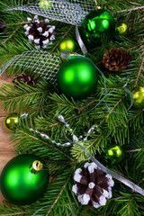 Christmas green baubles, pine cones and silver beads swag