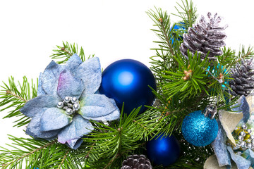 Christmas garland with silk poinsettias and fir branches on the white background