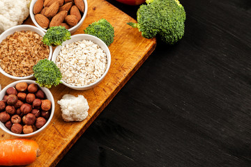 Fresh raw vegetables with nuts and cereals for cooking or eating. Vegetarian food. Top view