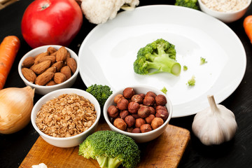 Fresh raw vegetables with nuts and cereals for cooking or eating. Vegetarian food.