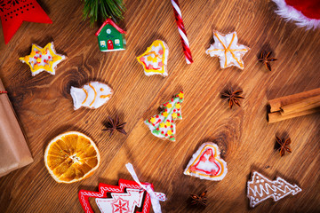 Top view of Christmas spices and decorations on wooden table