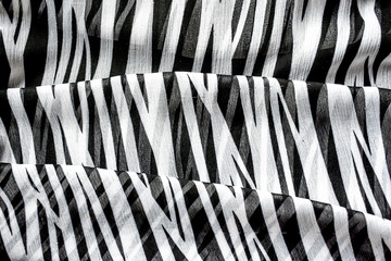 abstract background in black and white stripes - zebra, material in the style of African animal coloring