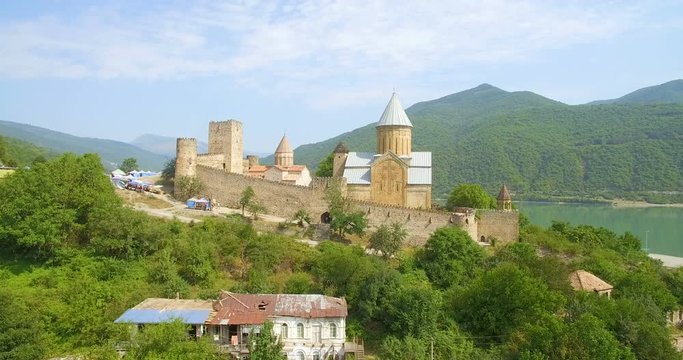 aerial drone video  of Ananuri fortress and Zhinvali reservoir in sunny day
