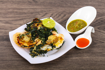 Baked scallops with spinach