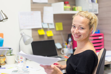 Business and entrepreneurship consept. Beautiful blonde business woman talking on mobile phone in...