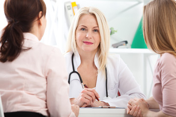 Fototapeta premium doctor explaining diagnosis to her female patient