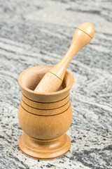 Wooden mortar on the grey marble table