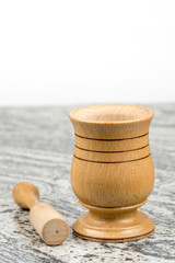 Wooden mortar on the grey marble table