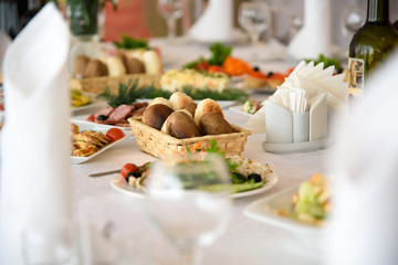 Luxury festive table with delicious food and drinks. New year's eve feast with delicious dishes. The anniversary of the restaurant.