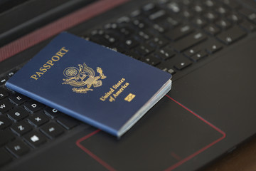American Passport On Laptop Keyboard