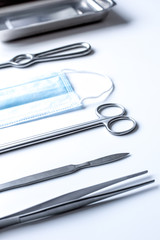 instruments for plastic surgery on white background