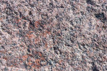 a fragment of a small area granite tiles as a background