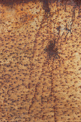 the view of the plot of the old rusty iron with streaks of rust