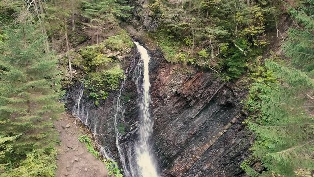 Aerial shoot of beautiful places in carpathian mountains. Waterfall Zhenetskyi Huk , Ukraine
