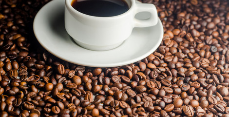 a cup of coffee, grains, books