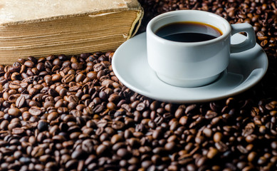 a cup of coffee, grains, books