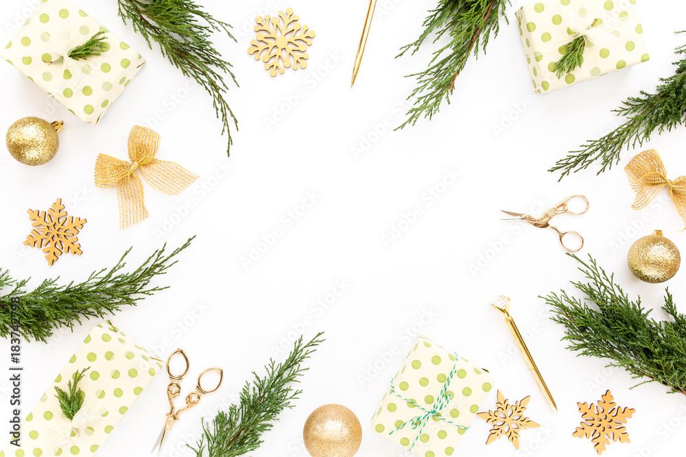 Wall mural christmas or new year frame composition. christmas decorations in gold colors on white background wi