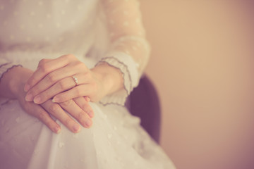 Close up woman with wedding ring,Hand with Diamond ring on white dress,