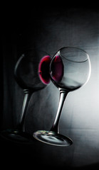 a glass of wine on a dark background