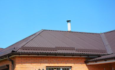 Problem Areas for Roofing Rain Gutter Waterproofing. Guttering Down pipe Fittings. Rain gutter system and roof protection from snow board (Snow guard) on house roofing.