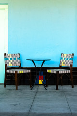 Colorful chairs with table outside