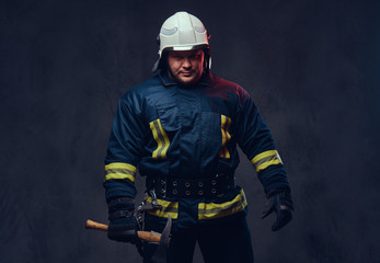 Fototapeta premium Firefighter holds the axe.