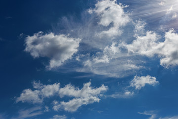 a beautiful blue sky day with white clouds as background