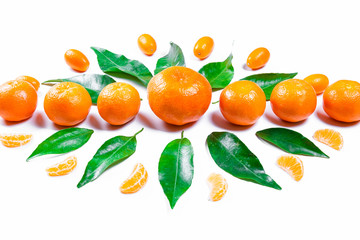 Mandarins fresh with leaves on a white background. Ripe delicious fruit. Symbol of the New Year and Christmas