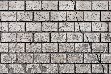 old brick wall with crack closeup
