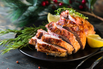 A large baked piece of meat. Festive ham